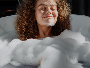 Young woman in bathtub